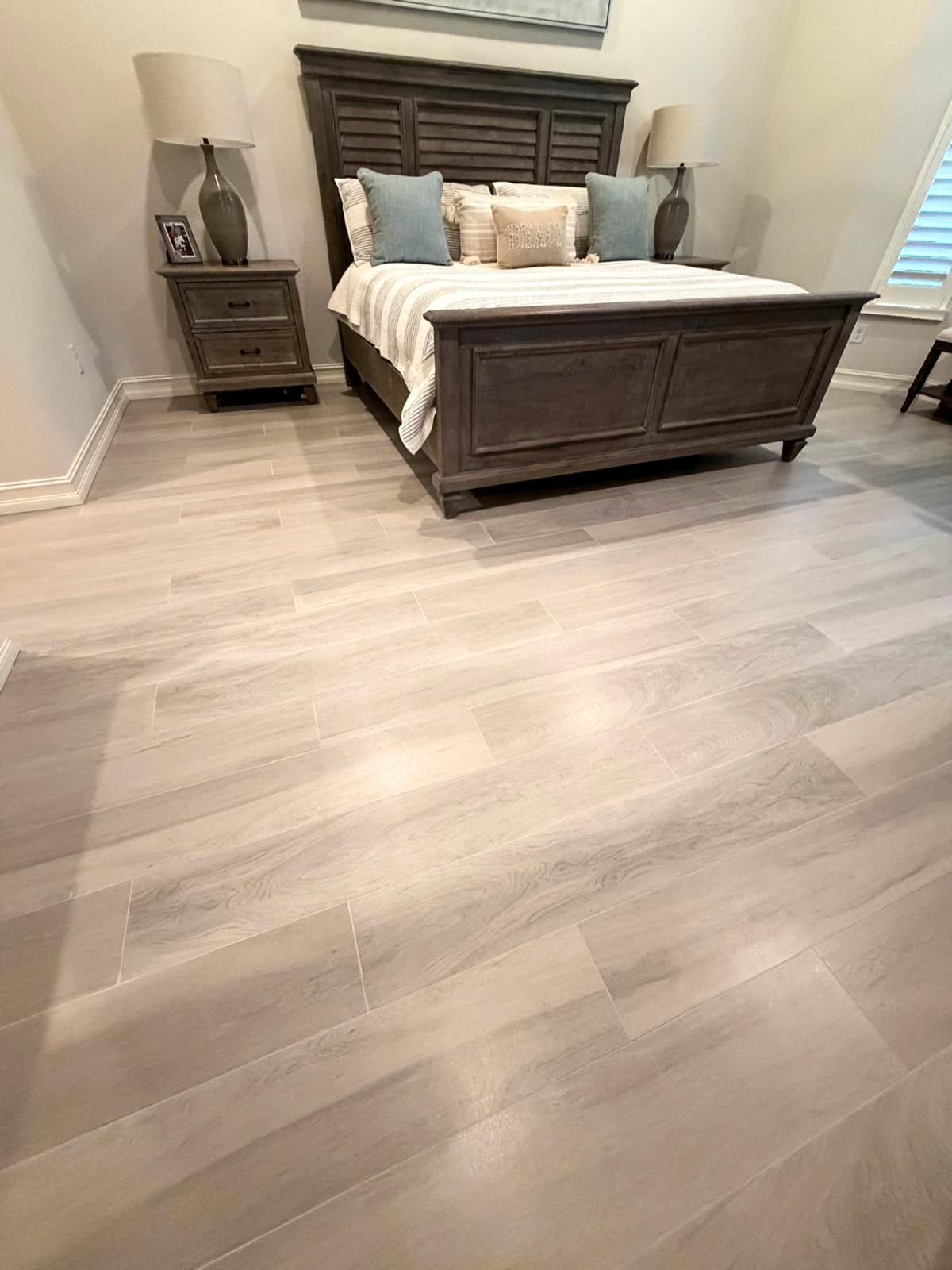 Wood-look plank tile bedroom floor