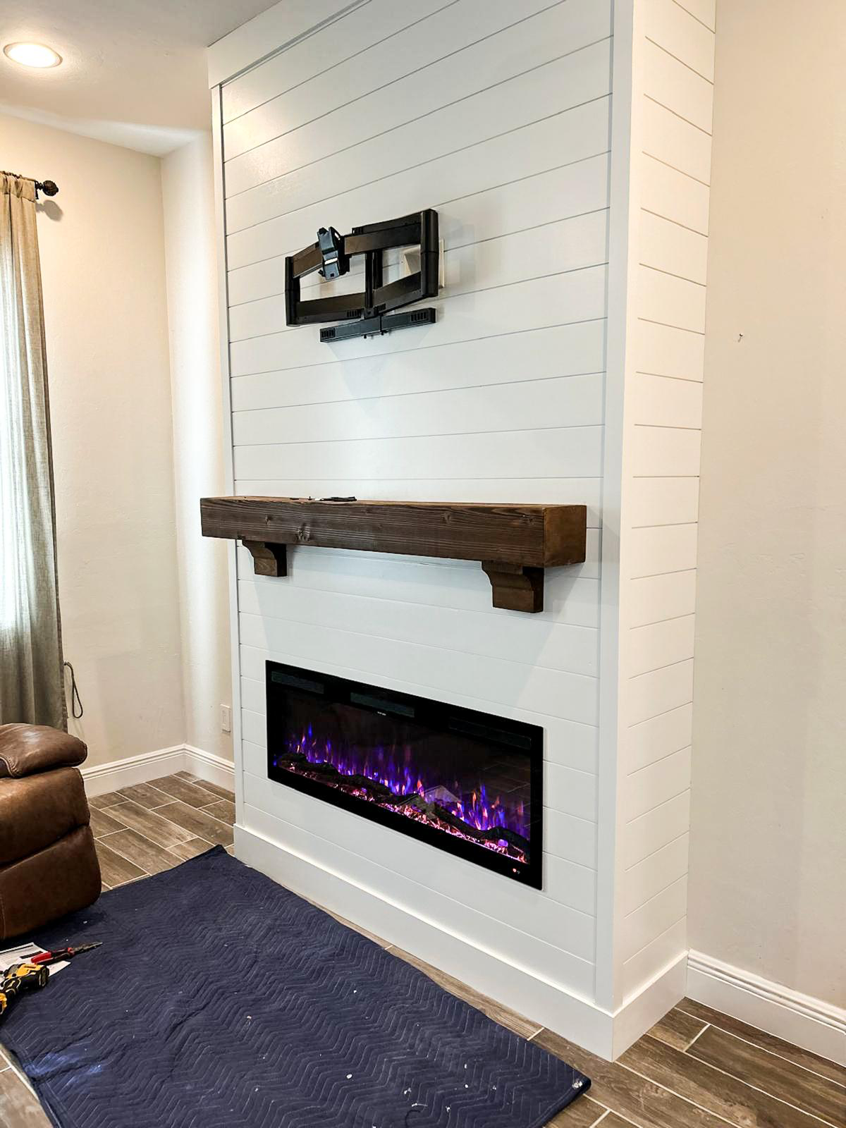Custom fireplace surround with shiplap and tile
