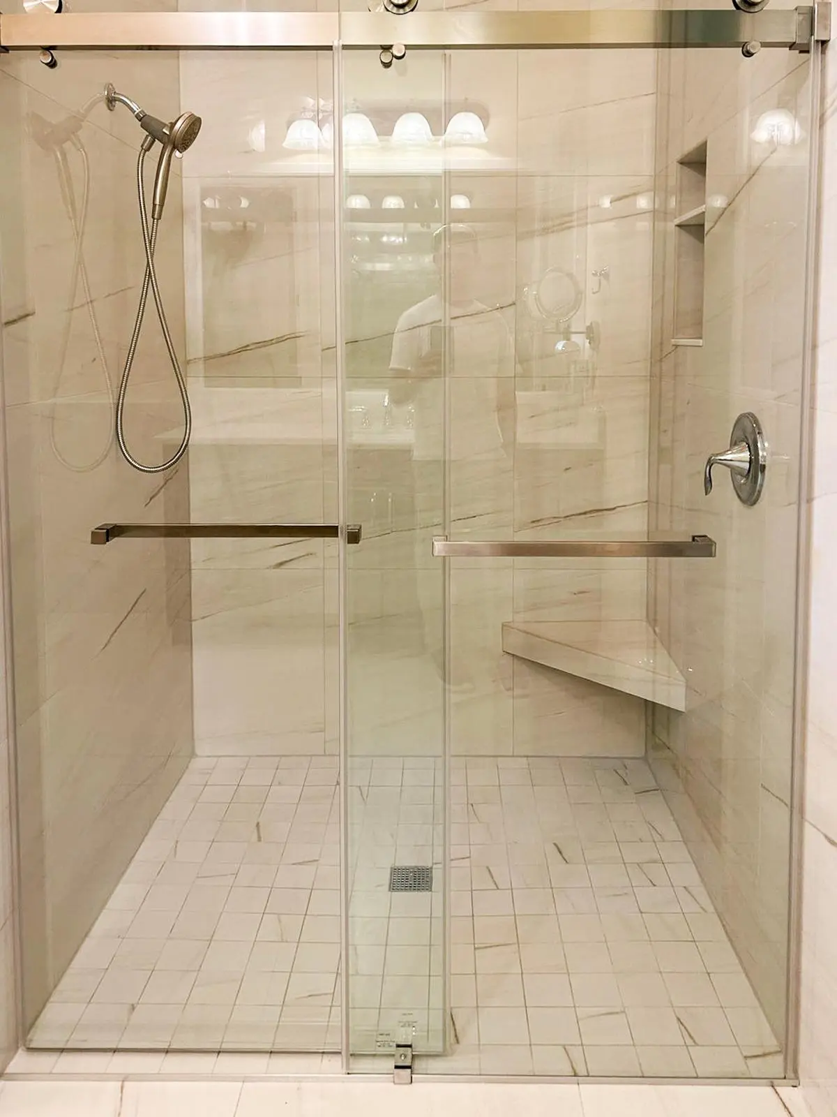 Sliding glass doors on a marble-look shower