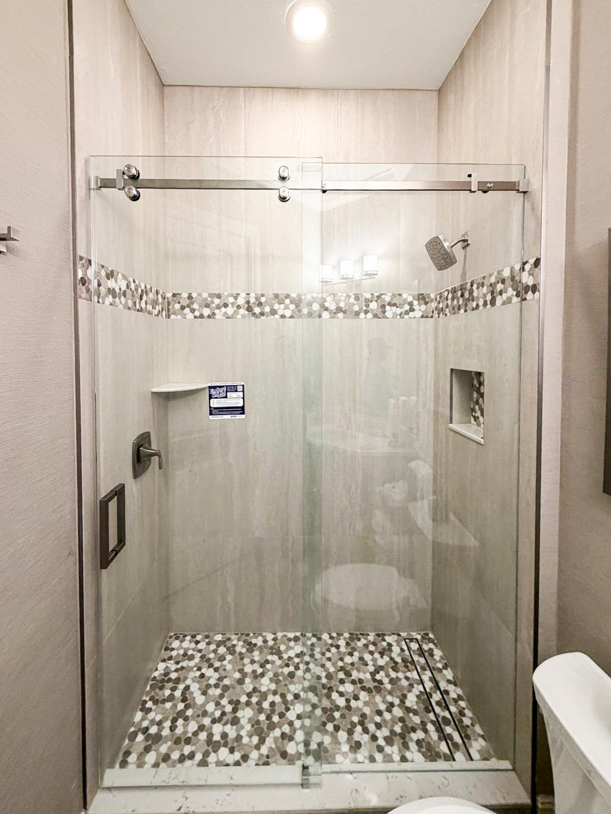 Shower with pebble mosaic pan