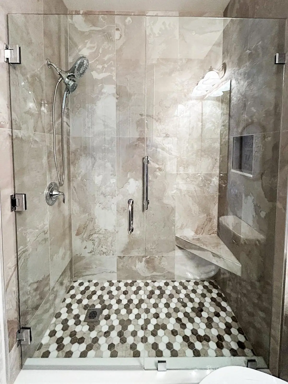 Hex mosaic shower pan and glass enclosure